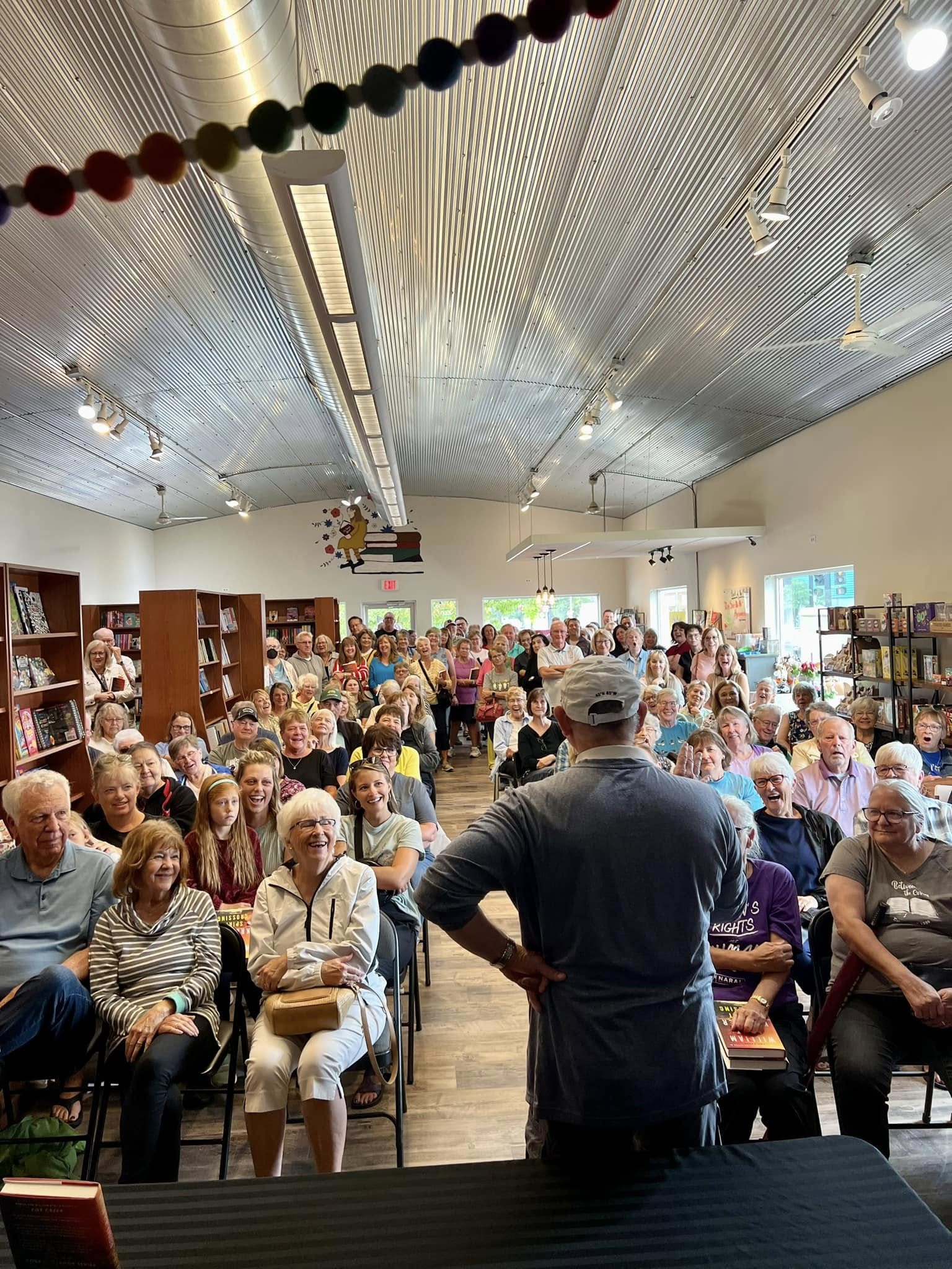 A crowded author event inside Cherry Street Books